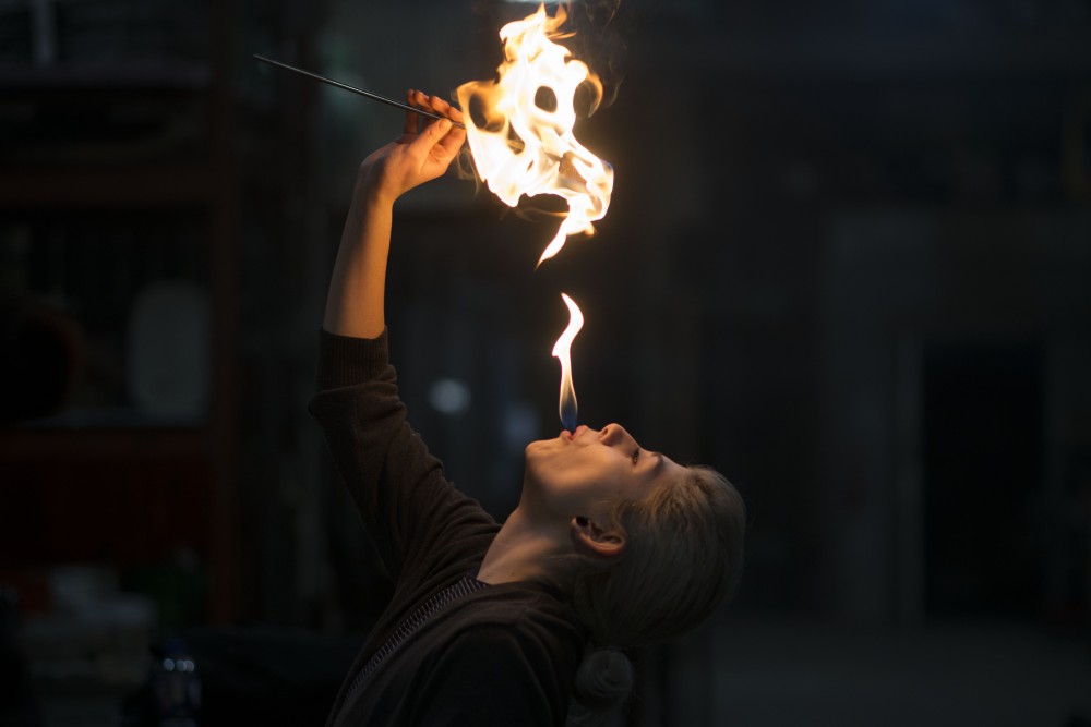 Brooke Lozano practices the dragons breath trick during a fire breathing lesson at the Minneapolis Fire Collective on Friday, March 8. 