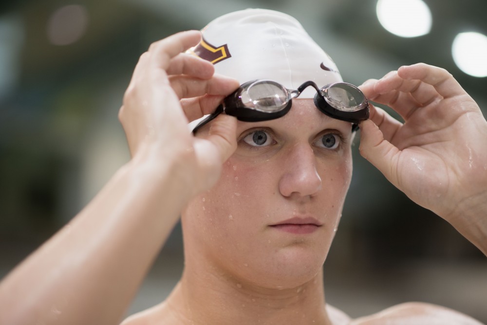 Max McHugh poses for a portrait in the Jean K. Freeman Aquatic Center on Monday, March 11. McHugh was named the Big Ten Freshman of the Year. 