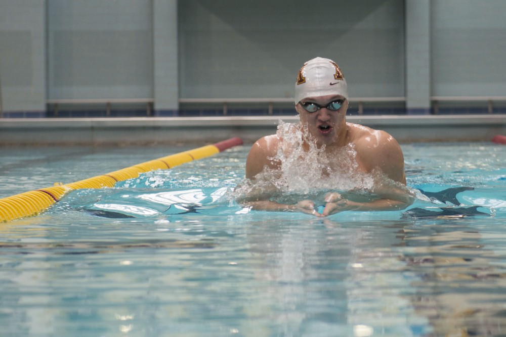 Max McHugh demonstrates the breaststroke in the Jean K.  Freeman Aquatic Center on Monday, March 11, 2019.