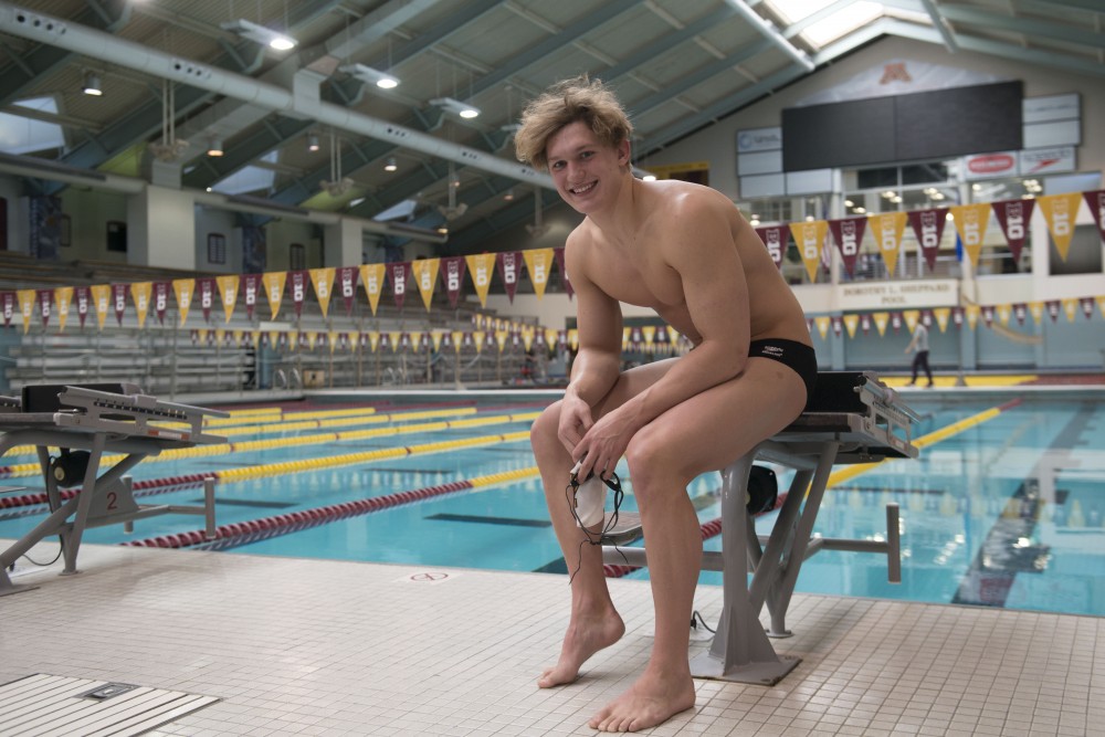 Max McHugh poses for a portrait in the Jean K. Freeman Aquatic Center on Monday, March 11. McHugh was named as the Big Ten Freshman of the Year. 