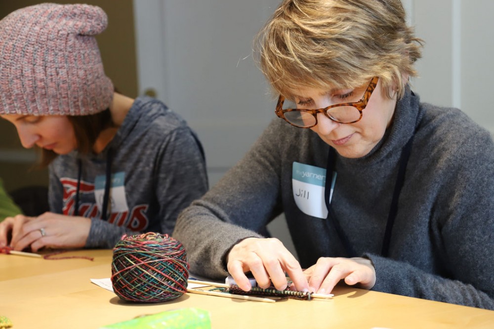 Jill McGuire knits a mitten in a class hosted by The Yarnery in Minneapolis on March 9. 