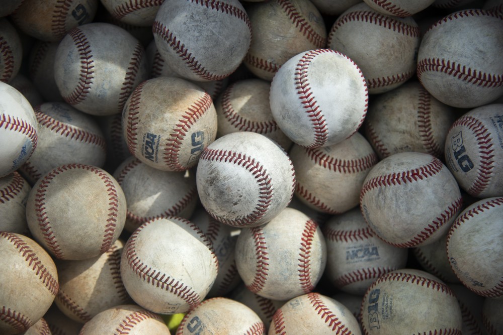 Extra balls lie in a box in the home dug out at Siebert Field on Friday, March 29. 