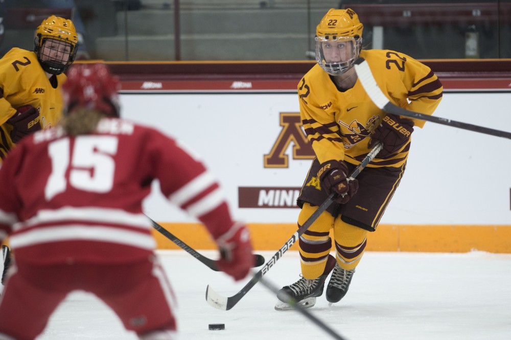 Forward Abigail Boreen keeps and eye on Wisconsins Caitlin Schneider on Sunday, March 10, 2019 at Ridder Arena.