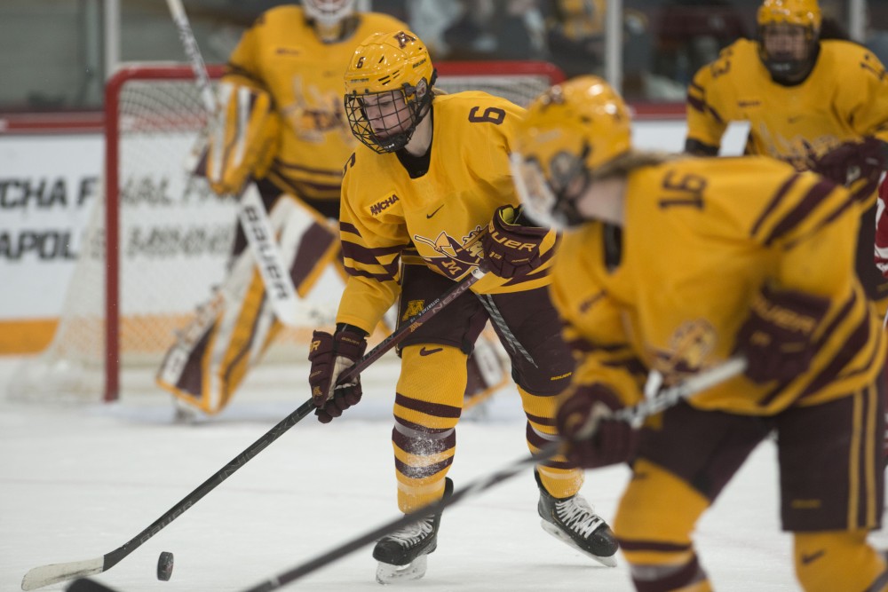 Freshman Gracie Ostertag handles the puck during the gopher game against Wisconsin at Ridder Arena on Sunday, March 10. 