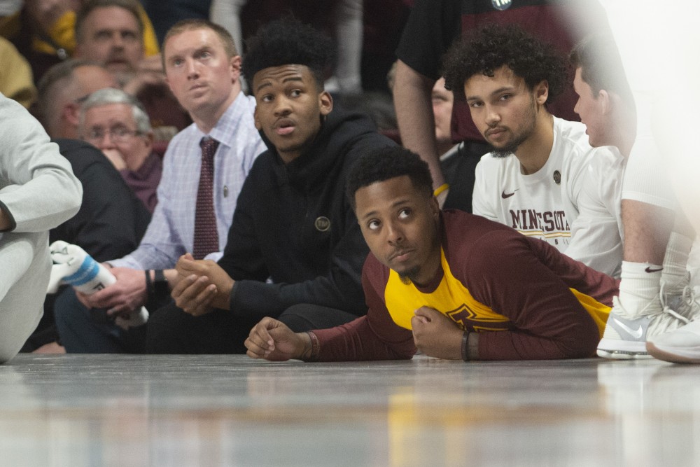 Senior Jarvis Johnson watches the game at Williams Arena on Tuesday, March 5. 