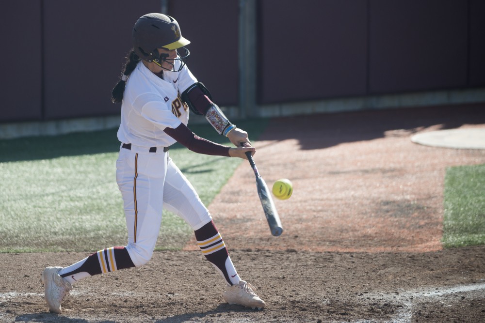 Sophomore Anne Miller hits the ball on Friday, March 29 at Jane Sage Cowles Stadium in Minneapolis. The Gophers beat the Purdue Boilermakers 5-1.