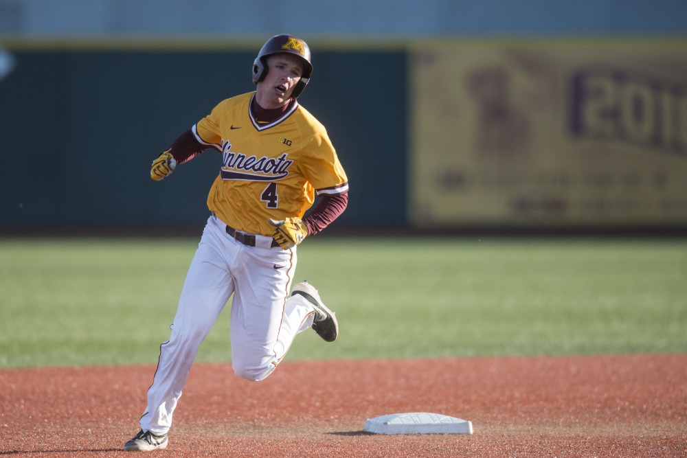 Catcher Eli Wilson rounds second base at Siebert Field on Friday, March 29. 