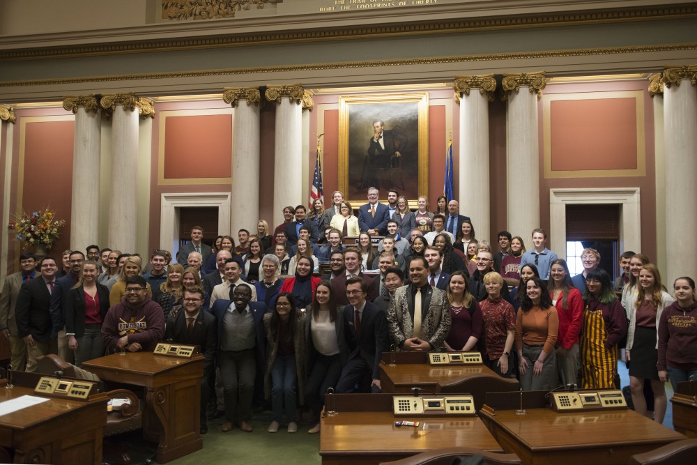 Students from multiple University of Minnesota campuses pose for a group photo at the Minnesota State Capitol on Wednesday, April 3 as a part of Support the U Day.