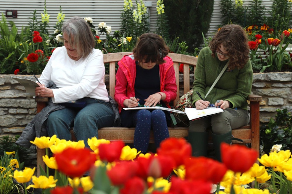 Nancy Shay, left, Luda Hart and Olive Hart enjoy an afternoon surrounded by flowers in the Como Park Zoo & Conservatory  on Thursday, April 4.