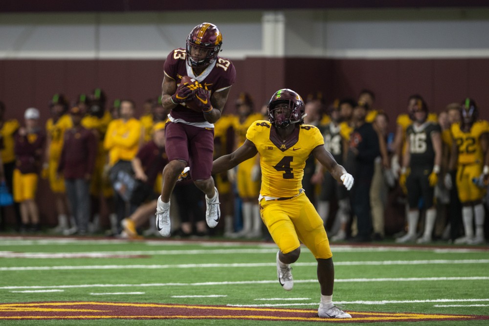 Wide receiver Rashod Bateman comes down with the ball on Saturday, April 13 at the football facility in Athletes Village. The Gopher football team participated in their annual spring football game.
