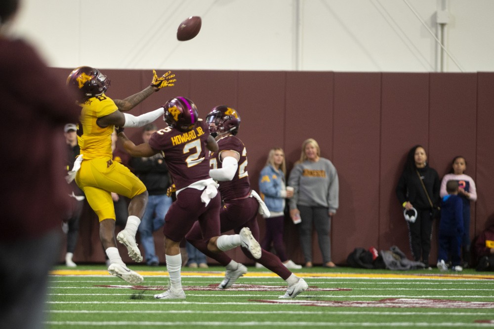 Senior Tyler Johnson catches a pass on Saturday, April 13 at the football facility in Athletes Village. The Gopher football team participated in their annual spring football game.