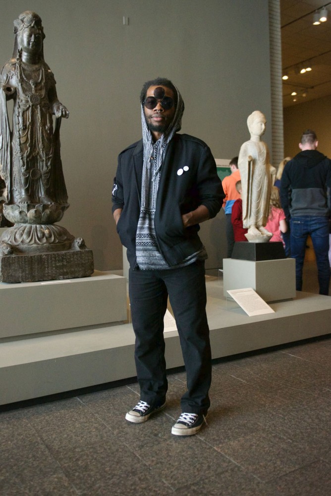 Nico Moore attends Art in Bloom at the Minneapolis Institute of Art on Saturday, April 13. When asked about his favorite piece of art, he said, I like that piece right there, that guy sitting in lotus.
