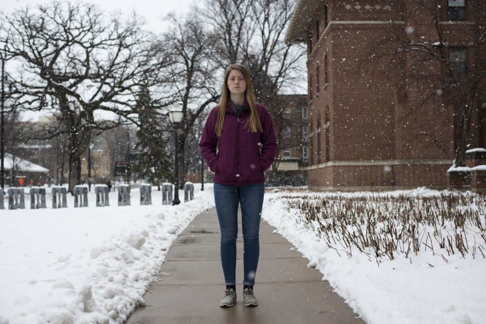 Sydney Cashman poses for a portrait outside Sanford Hall on Friday, April 12. Cashman lived at Sanford during the 2017-2018 school year and learned about her grandfathers death one morning when he didnt make it into work at the family ice cream shop, Licks Unlimited. Cashman and her younger brother now co-manage Licks Unlimited and hope to continue on their grandfathers legacy. 