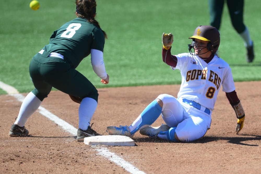 Macy Gill slides into third base at Jane Sage Cowles Stadium on Sunday, April 14. The Gophers beat Michigan State two games to none as part of their double header. 