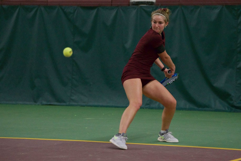 Sophomore River Hart returns the ball at the Baseline Tennis Center on Friday, April 12.