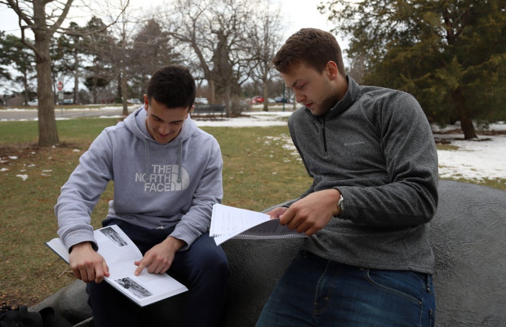 Mitch Van Sickle and Tommy Leitner collaborate on their assignment on St. Paul campus on Monday, April 15. 