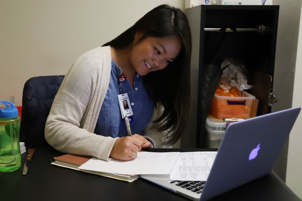 Patty Maglalang, a second-year pharmacy student, volunteers at the Phillips Neighborhood Clinic in Minneapolis on Monday, April 15. Part of her job at the clinic, which is staffed by University of Minnesota students and supervising clinicians, is to counsel patients on correct use of medications.
