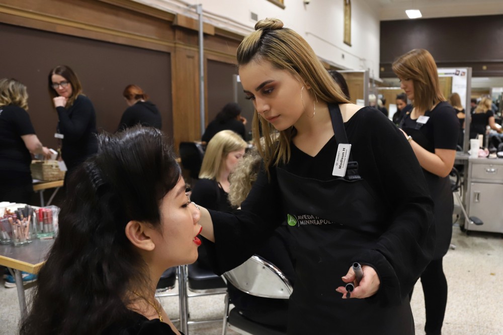 Madisun Heape does Adrianna Maniraths makeup for the Catwalks for Water Aveda fashion show on Saturday, April 20 in Minneapolis.