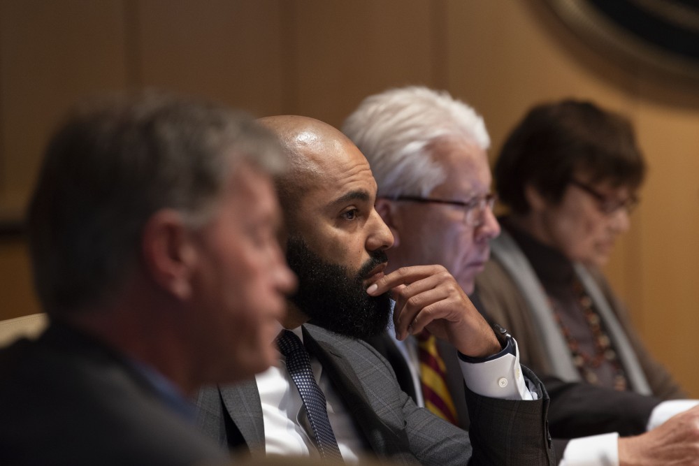 Regent Abdul Omari listens in on the Board of Regents special session on Friday, April 26. The board voted against the renaming of four buildings on campus after more than a year of community discussion on the issue. 
