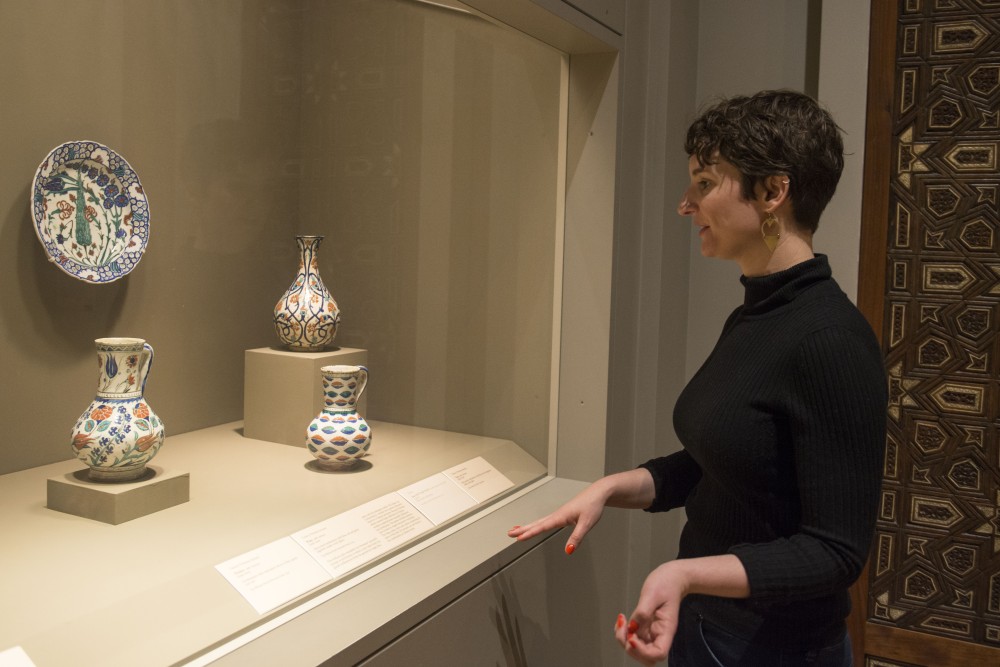 Alyssa Gregory, student researcher working on the Tudor room project, examines art in the Islamic gallery at the Minneapolis Institute of Art on Saturday, April 27, 2019. Since my background is in Islamic art, I was really excited to work with the Islamic collection, but around a story that not many people, including myself, knew about before, said Gregory.
