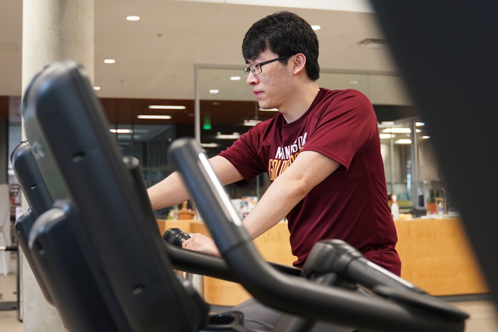 Council of Graduate Students President Sean Chen works out at the University Recreation and Wellness Center on Monday, April 29.