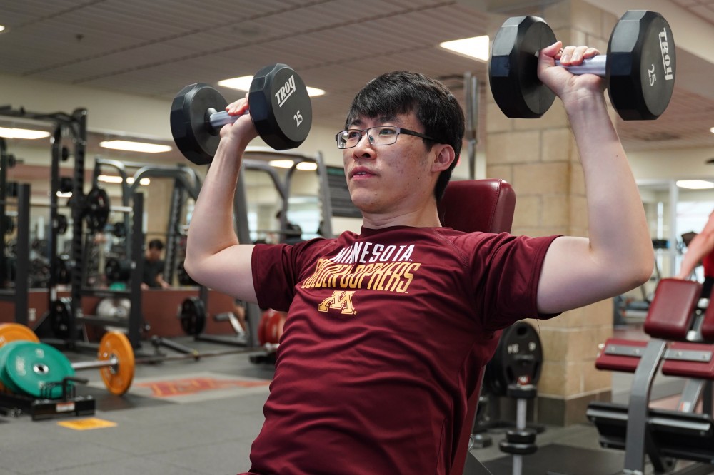 Council of Graduate Students President Sean Chen works out at the University Recreation and Wellness Center on Monday, April 29.