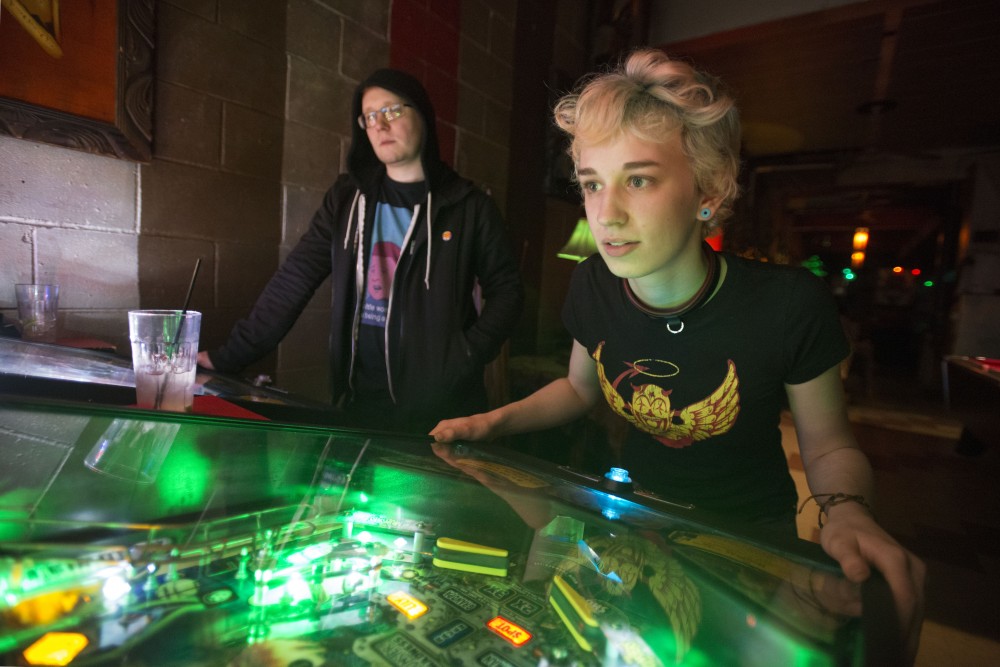 12:49 a.m.
Actor Jack Lasecke, right, and artist James Allen play pinball at the Kitty Cat Klub. 