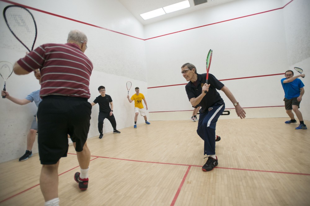 10:24 a.m.
Squash teacher John Stever warms up his students before class in the University Recreation and Wellness Center. Squash is like chess, racquetball is like checkers, Stever said.

