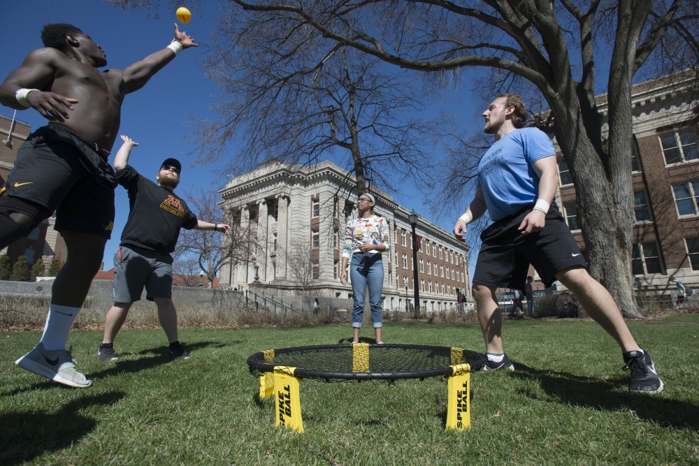 3:22 p.m.
Rogers Junior, left, Mike Toth, Mason Wylie and Tony Landucci play a game of Spikeball outside Northrup.