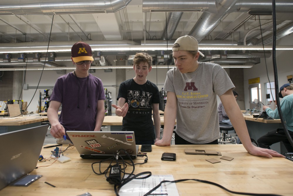 4:08 p.m.
Mathew Freeman, left, Ben Tyrell and Dan Black work on a project in the Anderson Innovation lab.
