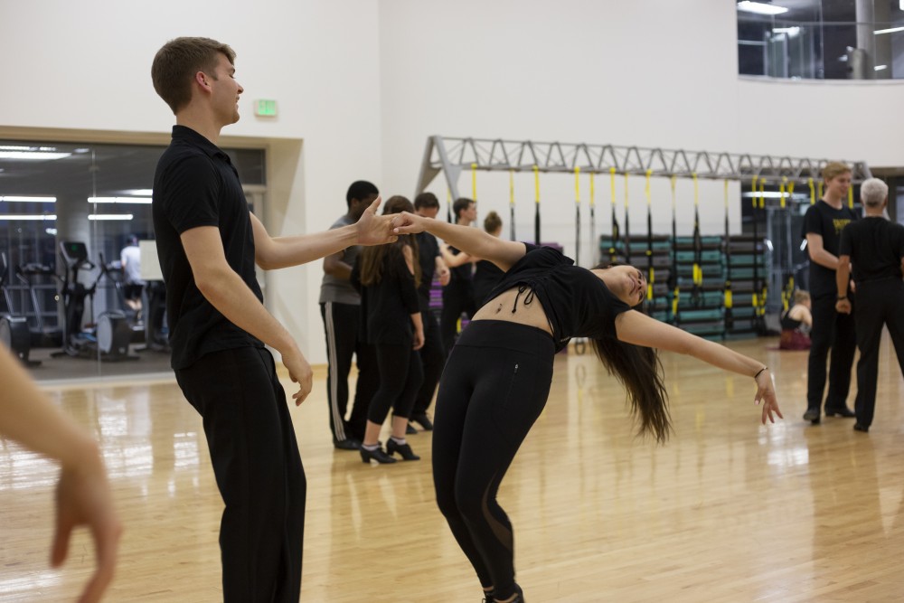 8:34 p.m.
Physics sophomore Kai Peterson dances with biology, society and environment junior Rachel Schwartz during ballroom dance practice at the University Recreation and Wellness Center. The two are members of the competition team, which won its second national championship in a row in early April.