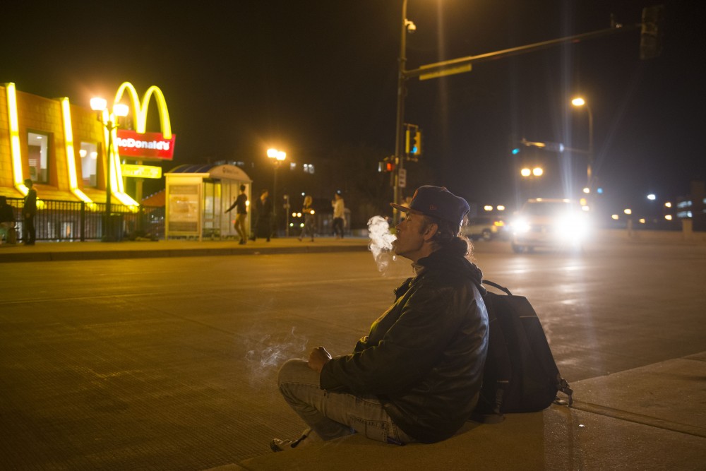 2:15 a.m.
Corey Hanson smokes a cigarette across from McDonalds in Dinkytown.