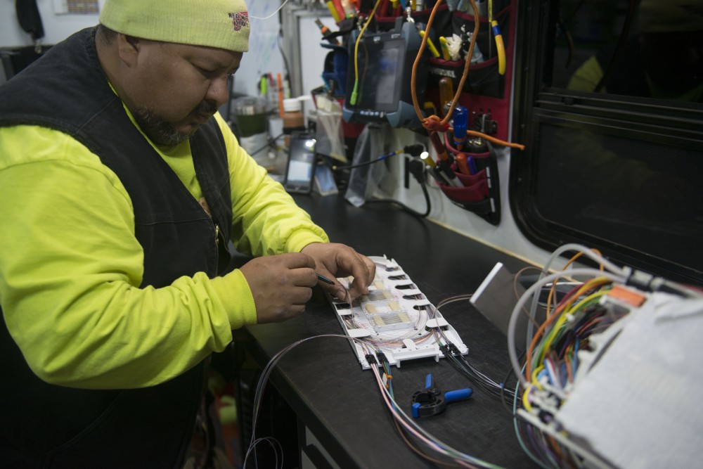 3:08 a.m.
A utility worker handles a confidential telecommunications project at the corner of 11th Ave and 6th St SE.