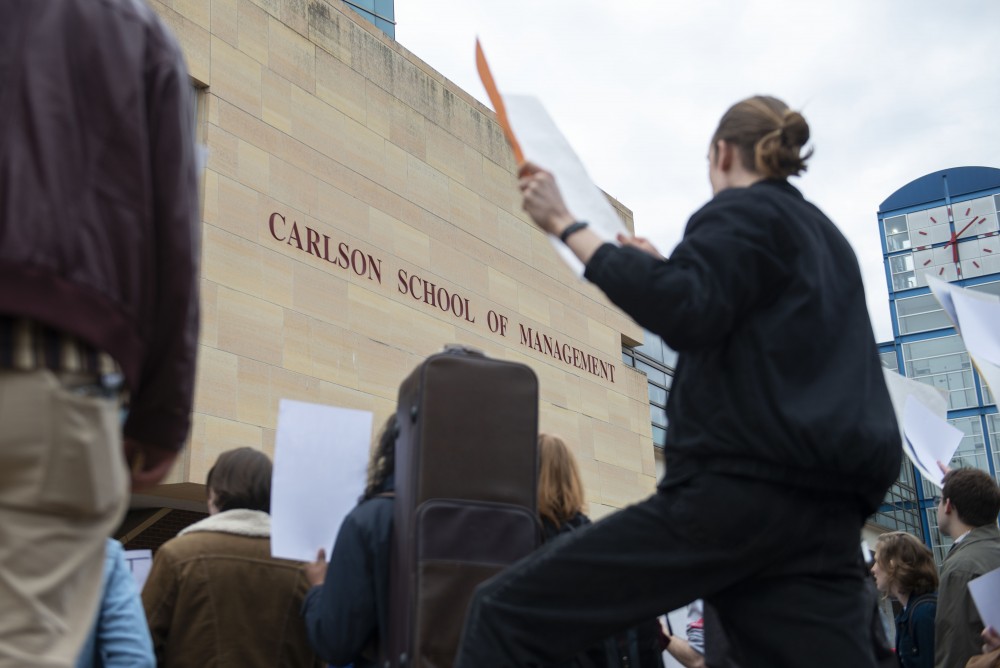 Demonstrators gather to protest the presence of Jeff Sessions on campus and his speaking at the Carlson School of Management on Monday, April 15. 