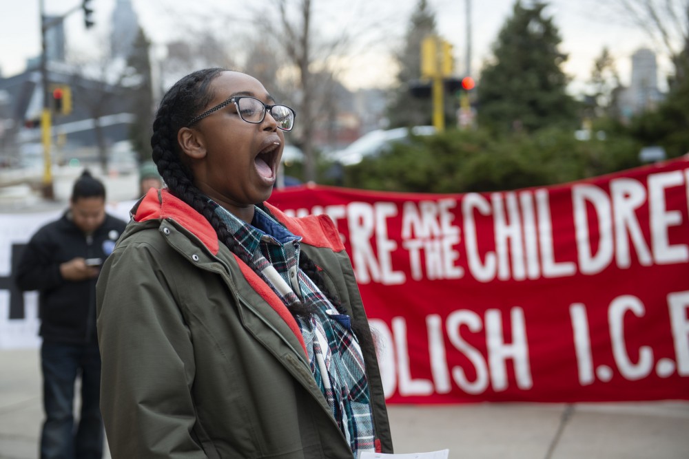 Lubna Mohamed Abdirahman leads a chant with other demonstrators to protest the presence of Jeff Sessions on campus and his speaking at the Carlson School of Management on Monday, April 15. 