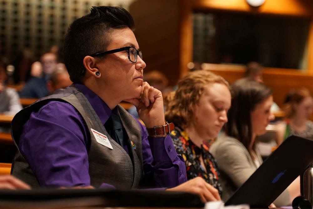 Dr. Saby Labor, director of the Gender and Sexuality Center for Queer and Trans Life, listens during a University Senate meeting on Thursday, May 2 at Mondale Hall. A nearly unanimous verbal vote to affirm the gender equity policy was passed at the meeting.  