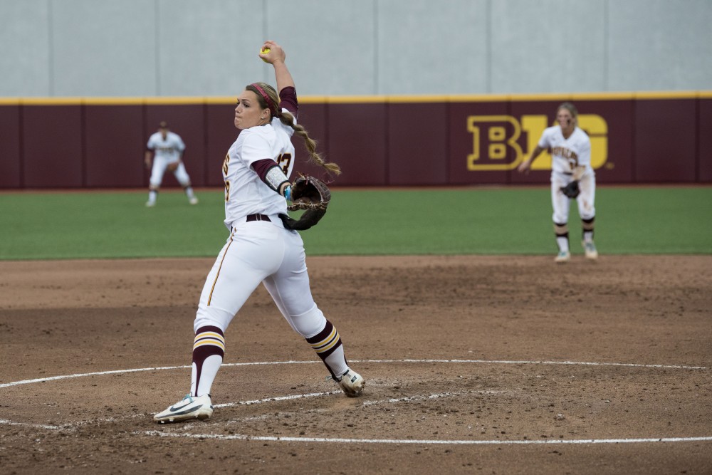 Amber Fisher pitches the ball at Jane Sage Cowles Stadium against Northwestern on Friday, May 3, 2019. 