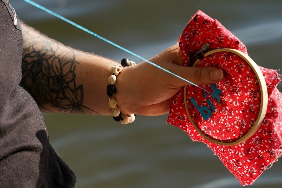 Liza Gorman-Baer works on an embroidery piece at Lake Calhoun on Saturday May 8th. 