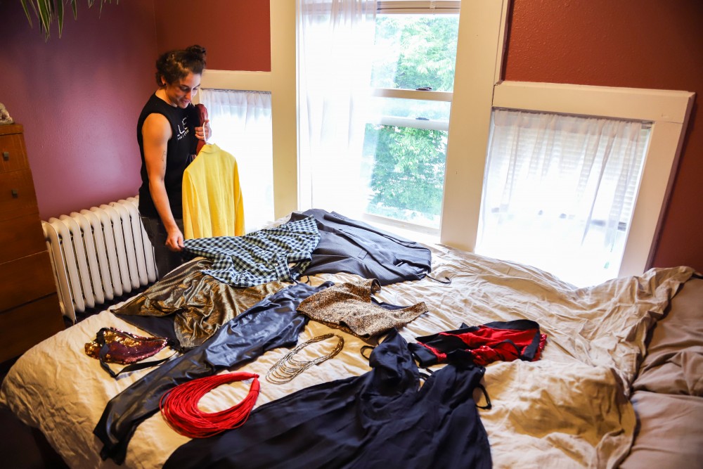 Marisol Herling looks through clothes while deciding what to wear to prom on Saturday, June 15 in Minneapolis. 