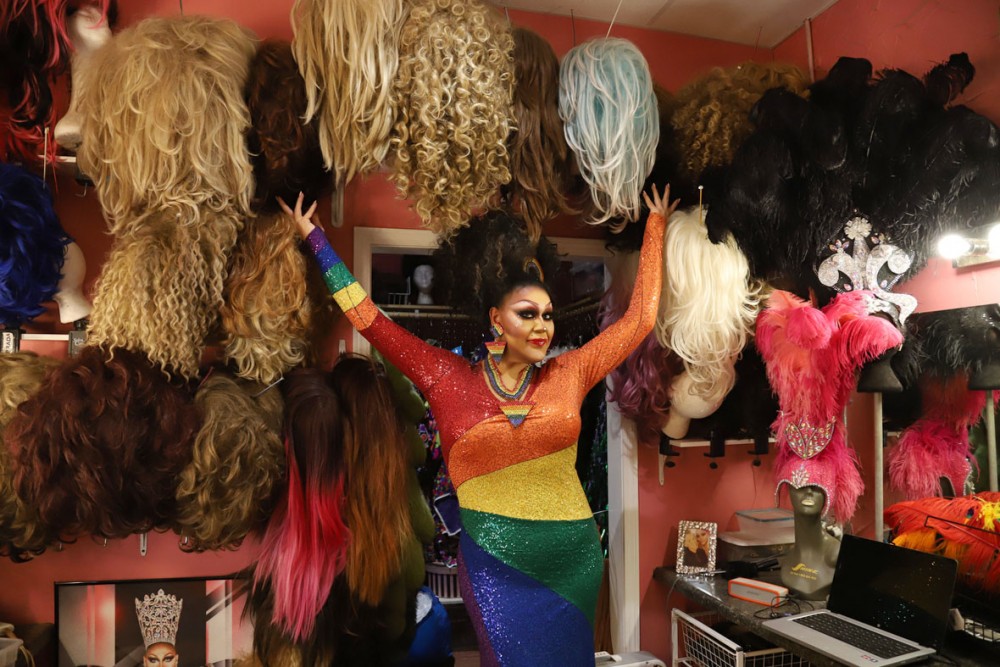 Prada Diamond shows off wigs in the dressing room at the Gay 90s in Minneapolis on Friday, June 20. 