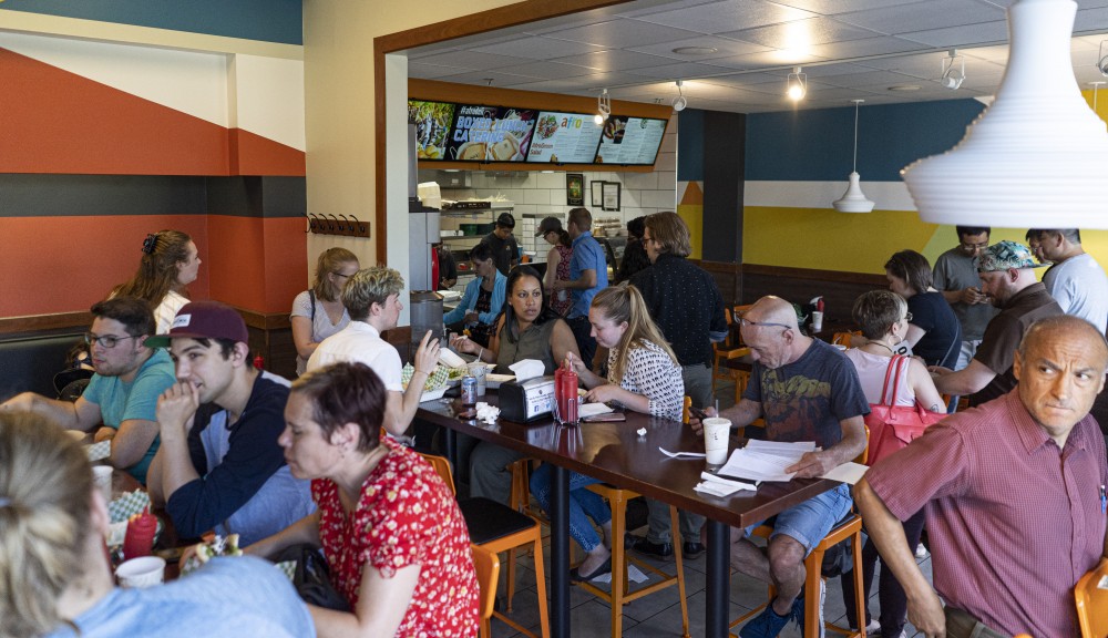 Lunch hour fills the restaurant on Friday, June 28 at Afro Deli in Stadium Village, Minneapolis. 
