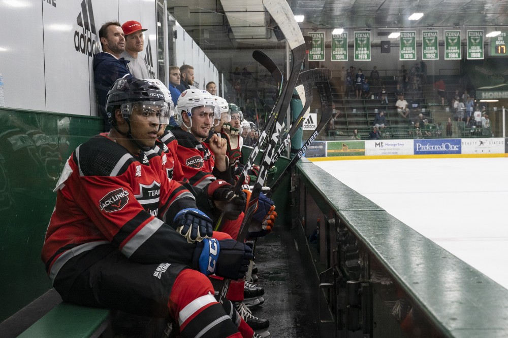 Players from the Jack Links team watch as their teammates take on their opponents, Tria Health, in the second game of Da Beauty League at Braemar Arena in Edina on Wednesday, July 18.