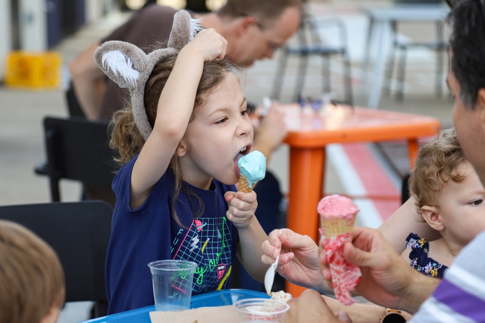Clara Samper-Zelaya licks her ice cream on Saturday, July 20 at Izzys Ice Cream in Minneapolis. 
