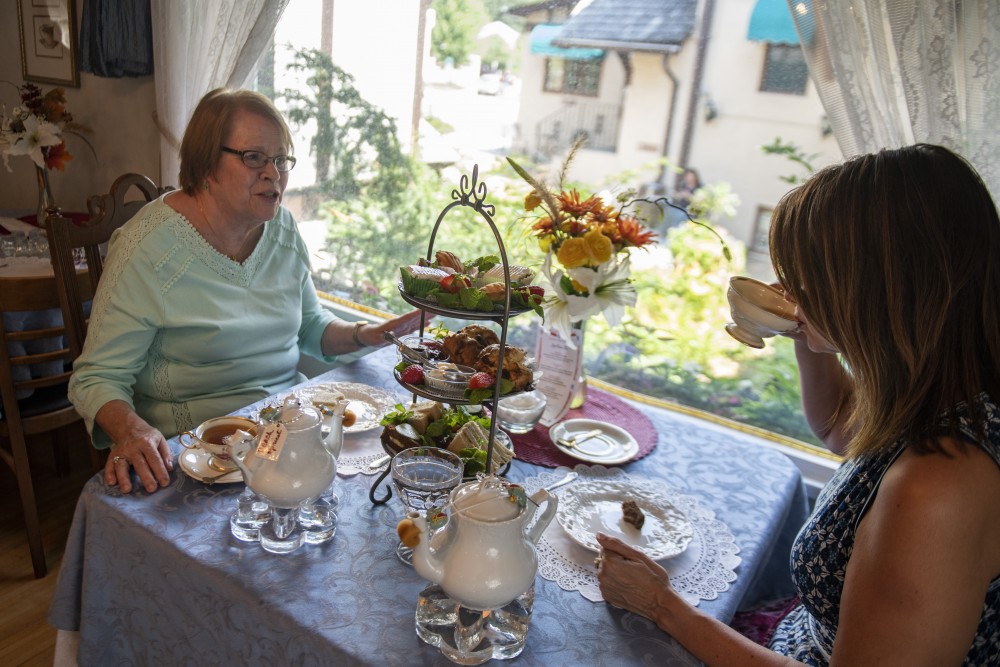 Barbara and Peggy Haselman enjoy tea and pastries on Wednesday, July 24 at Lady Elegants Tea Room & Gift Shoppe in St. Paul. 