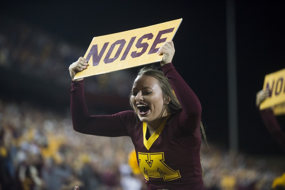 A Gopher Cheerleader prompts the crowd at TCF Bank Stadium on Thursday, Aug. 29. Minnesota defeated South Dakota State 28-21.