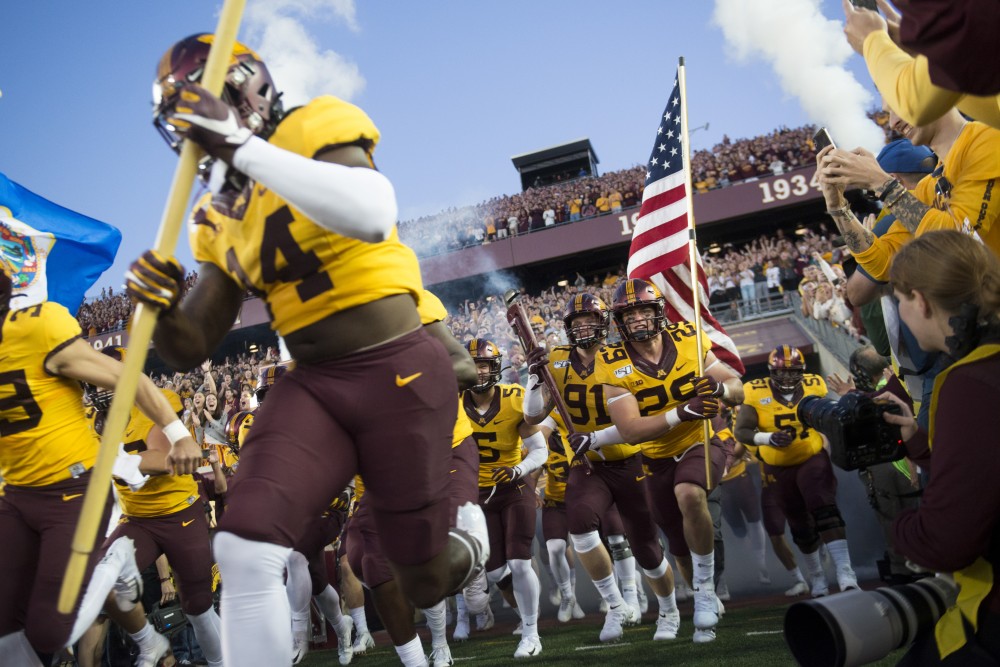 The Gophers run on to the field at TCF Bank Stadium on Thursday, Aug. 29. Minnesota defeated South Dakota State 28-21.