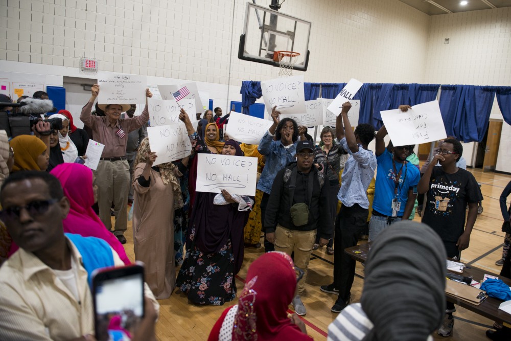 Demonstrators disrupt a community listening session at Pillsbury United Communities Brian Coyle Center on Friday, Aug. 30. 