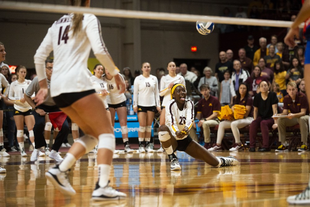 Outside Hitter Adanna Rollins reaches to receive the ball at the Maturi Pavilion on Saturday, Sept. 7. The Gophers defeated Florida 3 sets to 0 for their home opener. 