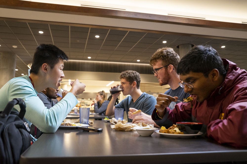 From left, Mike Lau, Roudra Bhattacharya, Nathan Hafey, Matt Legler and Jeevan Prakash enjoy a meal in the newly renovated Pioneer Dining Hall on Wednesday, Sept. 11. Pioneer replaces Centennial as the only dining hall available to students living in Superblock. 