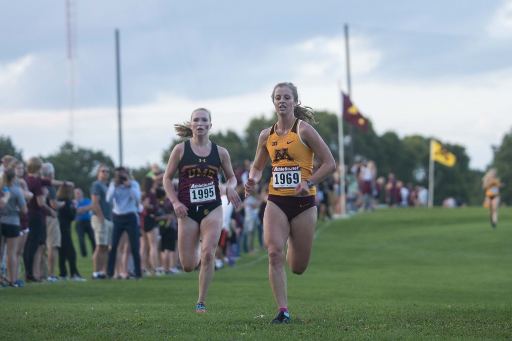 Redshirt Junior Kelsey Sather sprints to cross the finish line of the Oz Memorial at the Les Bolstad Golf Course on Friday, Sept. 6. 